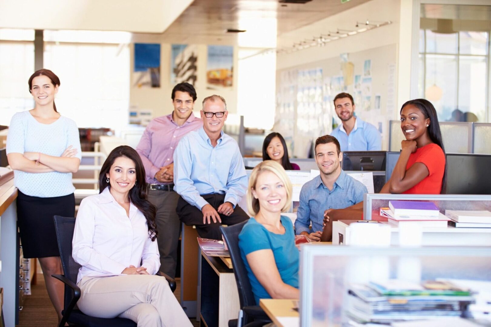 Diverse office team smiling at workspace