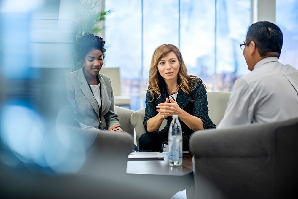 Business team meeting in modern office lounge