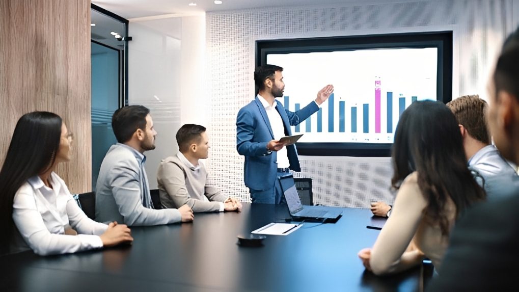 Business presentation in boardroom with bar chart